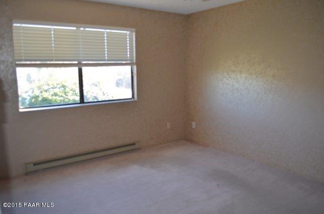 425 Buckskin Road Prescott, AZ 86301 - Photo 16 of 24 an empty room with a window