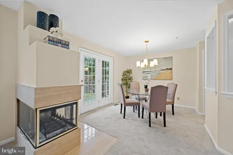 a kitchen with a refrigerator a stove top oven a sink and cabinets