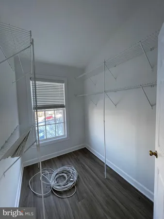 a bathroom with a tub sink toilet and mirror
