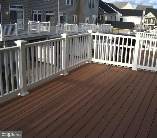 a view of a balcony with wooden floor