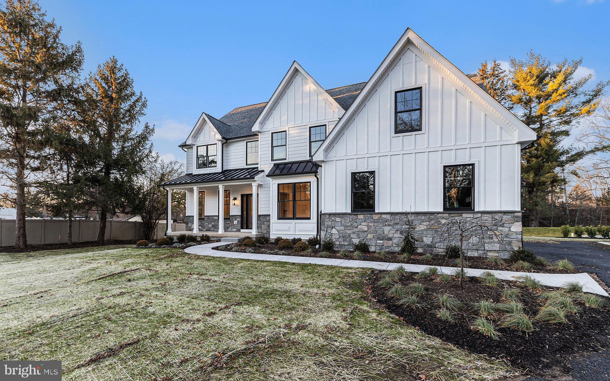 a view of a white house with a yard