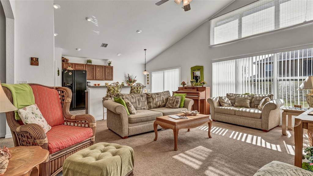1153 Legatto Loop Dundee, FL 33838 - Photo 13 of 48 a living room with furniture and a large window