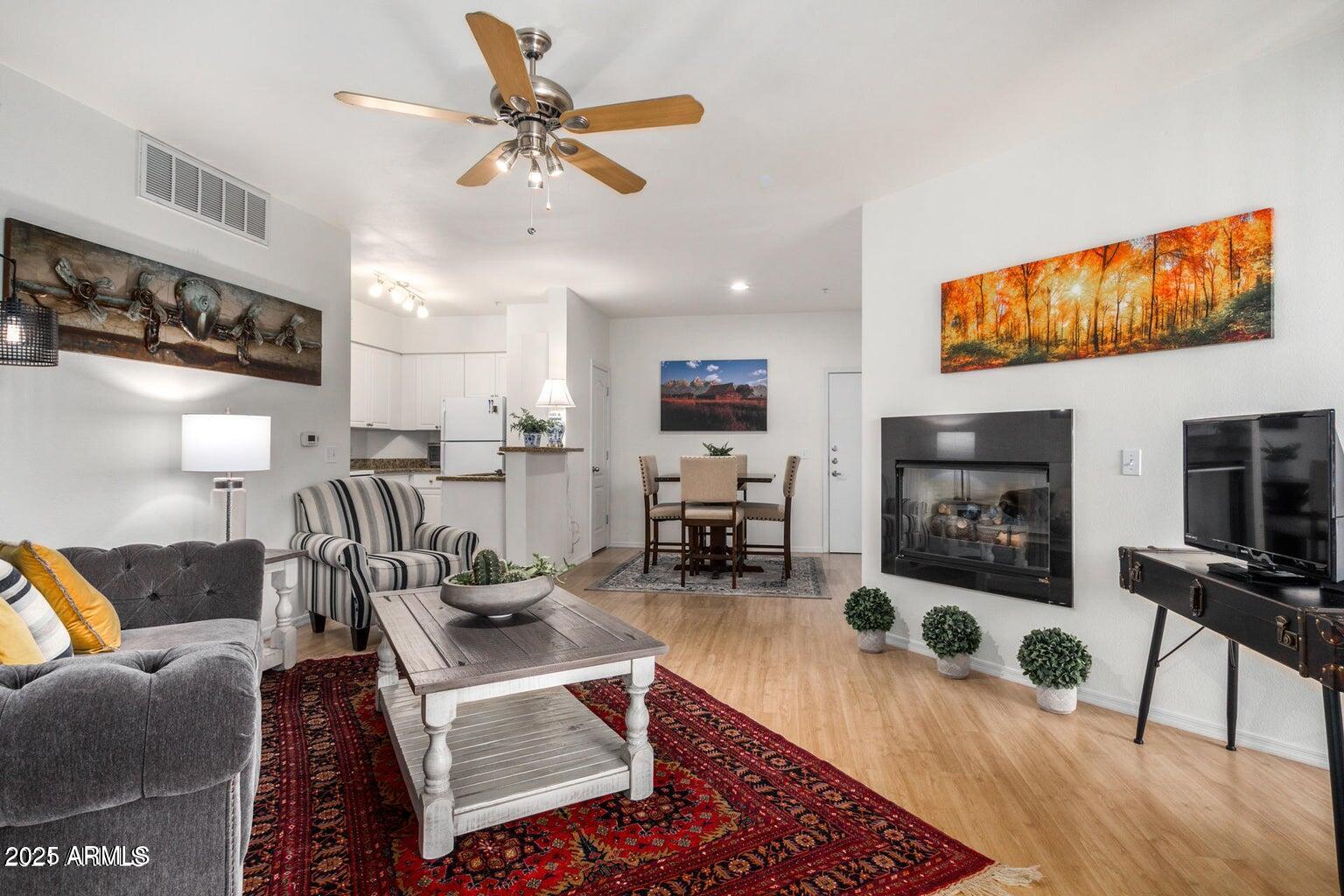 a living room with lots of furniture and a flat screen tv