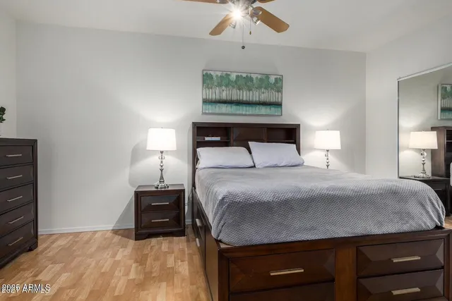 a bedroom with a bed and a cabinets