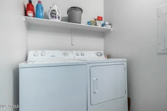a utility room with dryer and washer