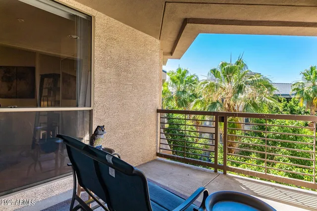 a view of balcony with furniture