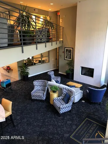 a living room with furniture and a rug