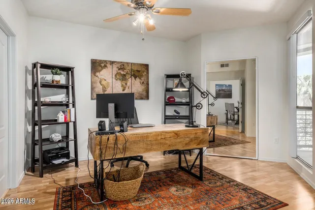 a dining room with furniture and window