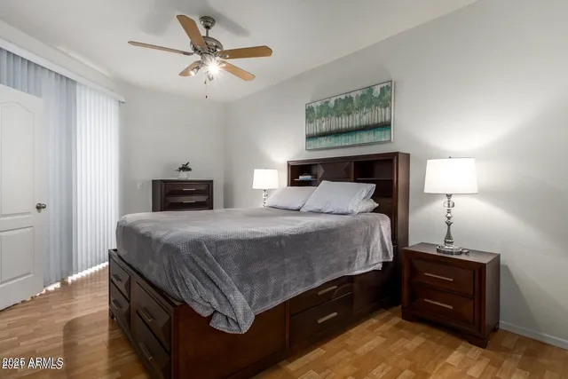 a bedroom with a bed and a lamp