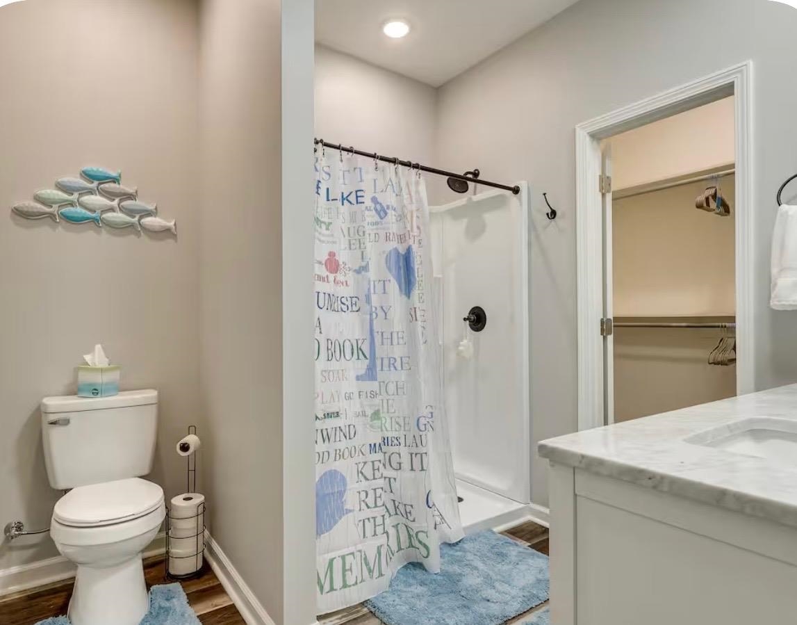 110 Bogey Loop Counce, TN 38326 - Photo 12 of 18 Full bathroom featuring a white vanity with a light-colored countertop, an undermount sink, and a framed mirror above