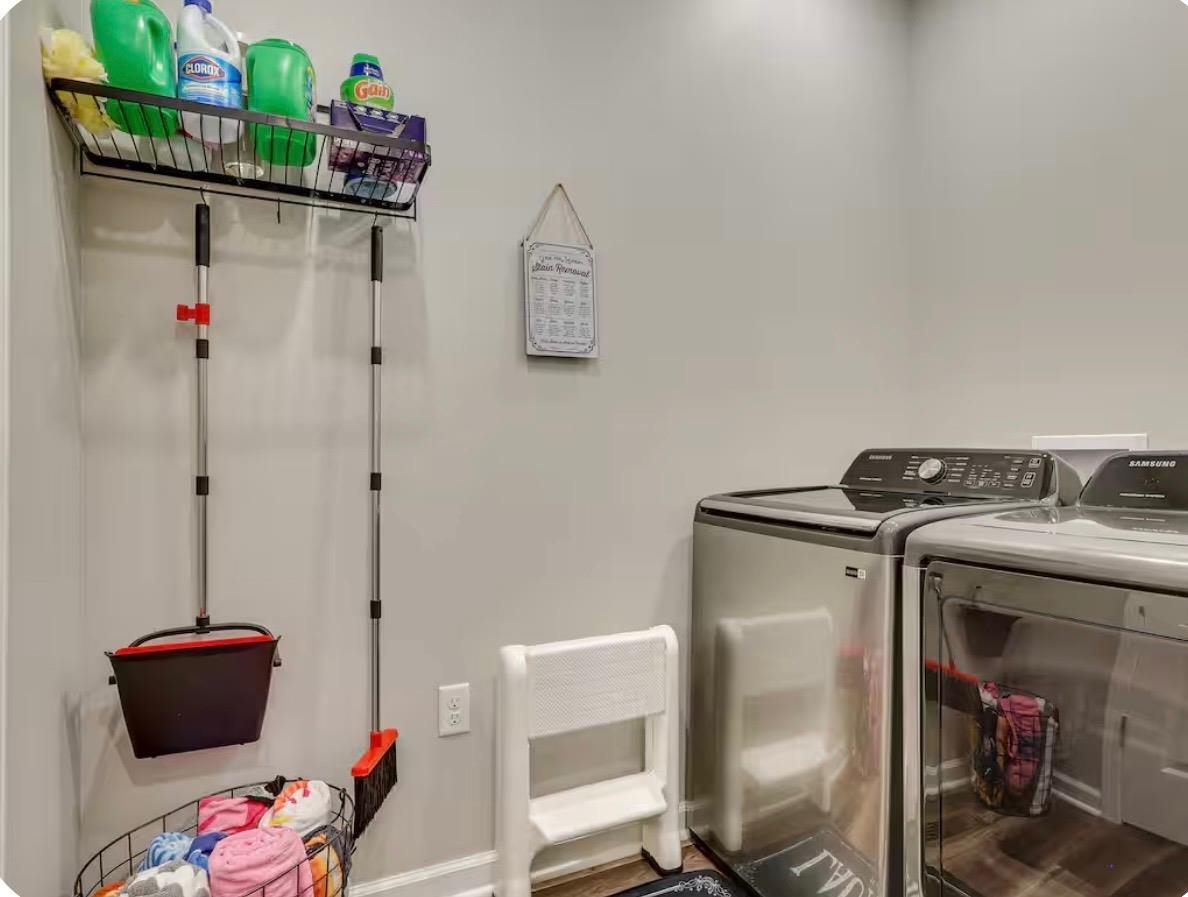 110 Bogey Loop Counce, TN 38326 - Photo 15 of 18 Laundry area featuring light gray walls, wood-finish flooring, and built-in overhead shelving