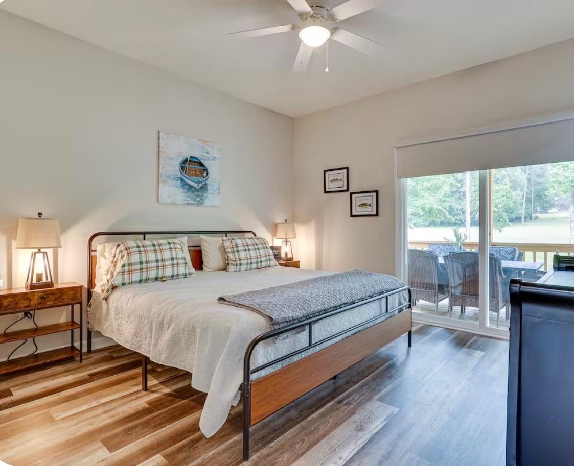 110 Bogey Loop Counce, TN 38326 - Photo 8 of 18 Spacious room featuring wood-finish flooring, vaulted ceilings, and a ceiling fan
