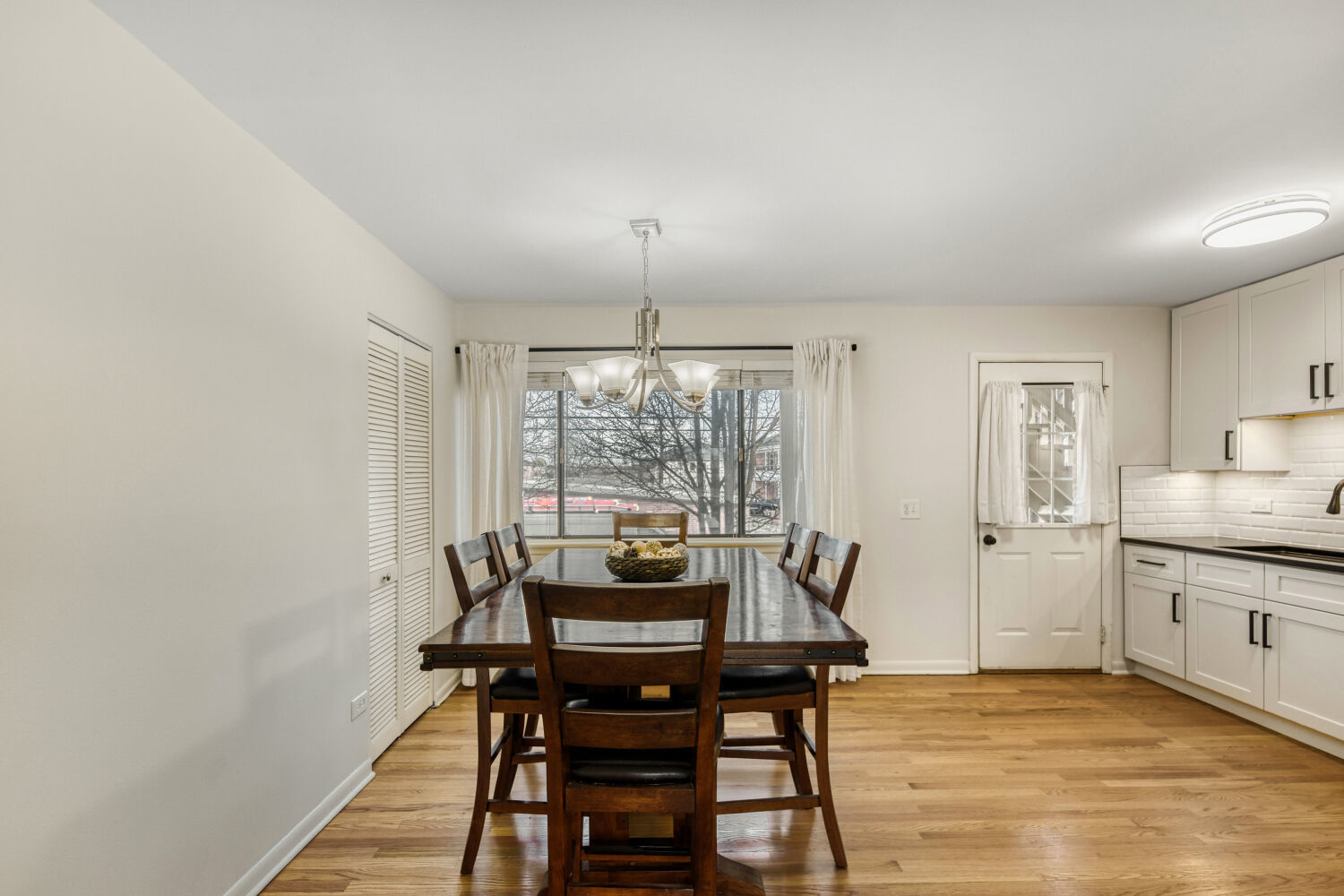 1710 Dempster Street, Unit B Park Ridge, IL 60068 - Photo 13 of 27 a view of a dining room with furniture and window