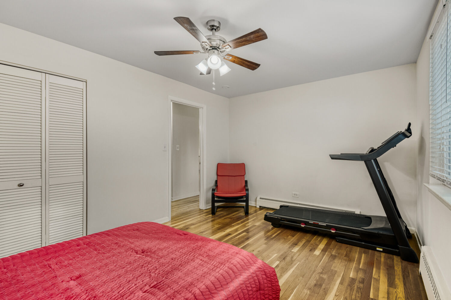 1710 Dempster Street, Unit B Park Ridge, IL 60068 - Photo 23 of 27 a bedroom with a bed and a chandelier