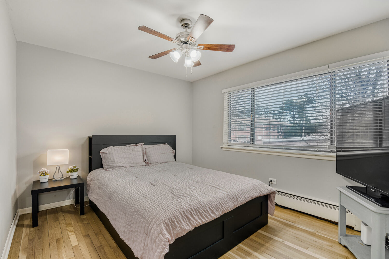 1710 Dempster Street, Unit B Park Ridge, IL 60068 - Photo 25 of 27 a bedroom with a bed and a flat screen tv