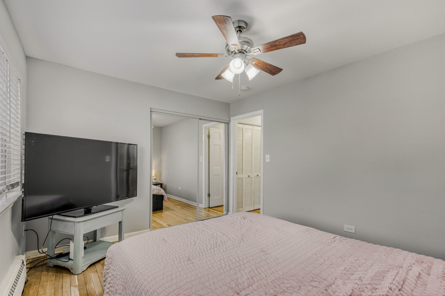 1710 Dempster Street, Unit B Park Ridge, IL 60068 - Photo 26 of 27 a bedroom with bed and flat screen tv