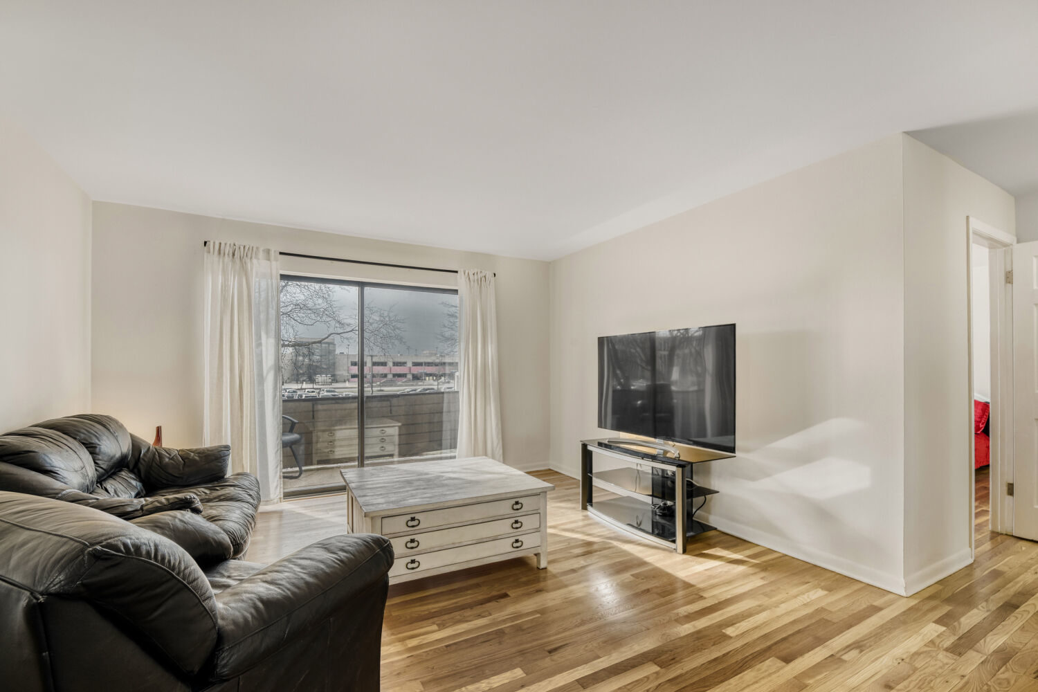 1710 Dempster Street, Unit B Park Ridge, IL 60068 - Photo 7 of 27 a living room with furniture and a flat screen tv