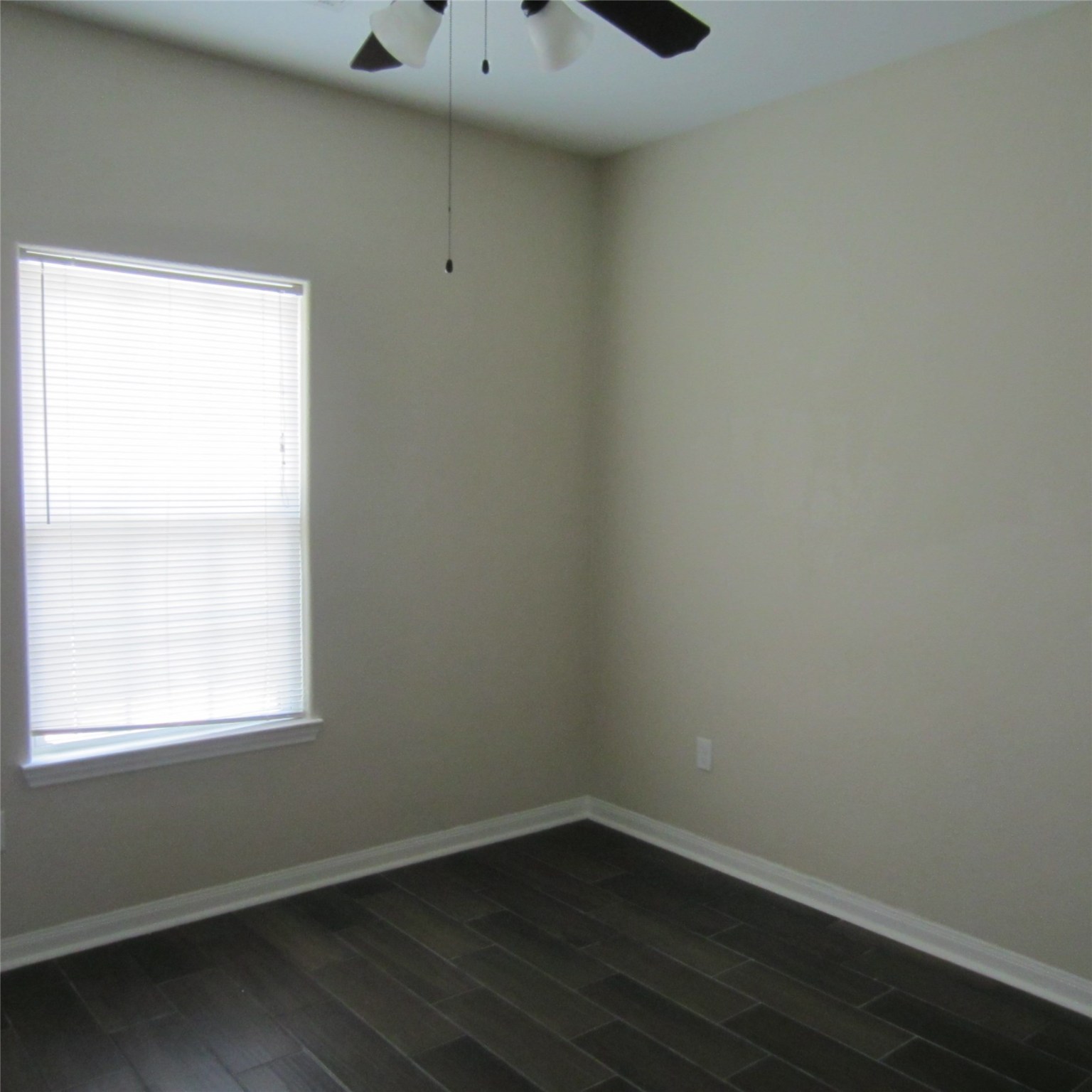 23431 Mcspadon Road, Unit 23415 Porter, TX 77365 - Photo 7 of 10 a view of a small space with wooden floor and a window