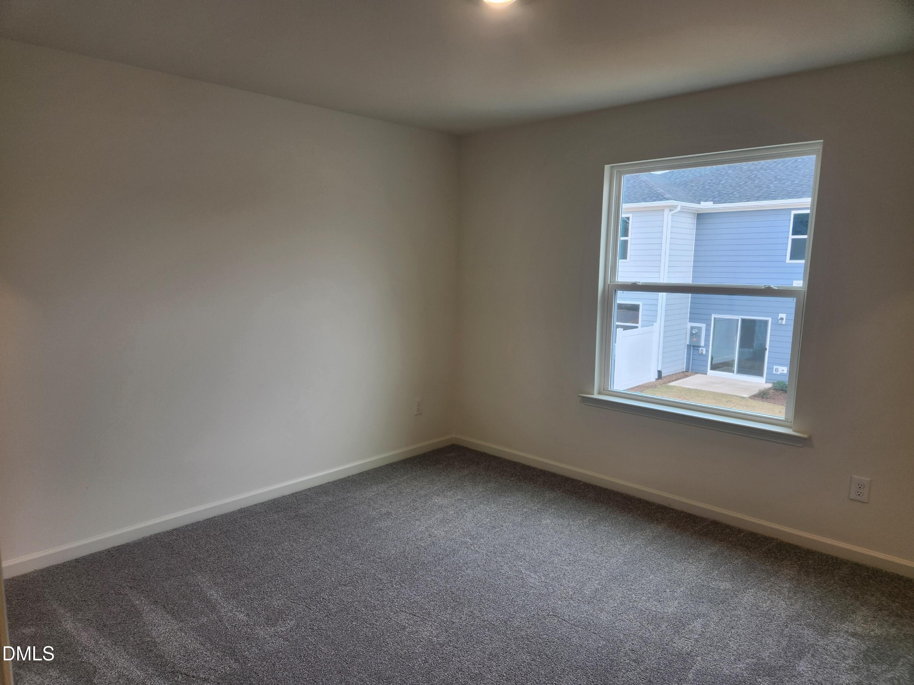 2218 Rabbitbrush Street Durham, NC 27704 - Photo 3 of 12 an empty room with a window