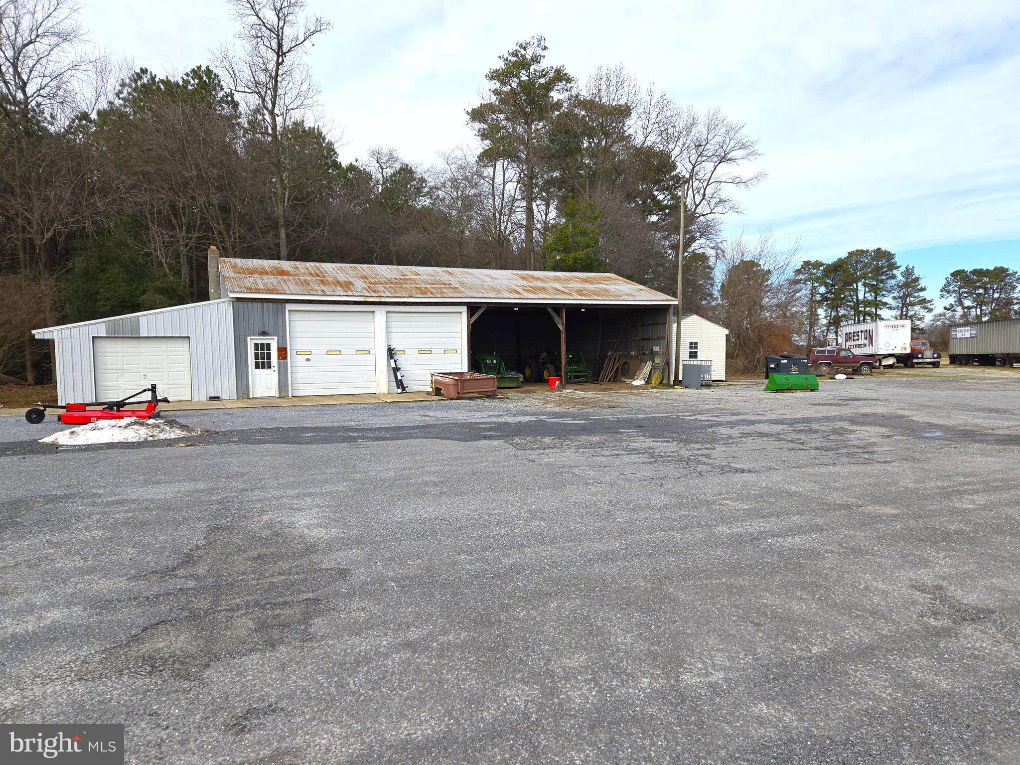 21498 Dover Bridge Road Preston, MD 21655 - Photo 20 of 33 a view of a white house with a outdoor space