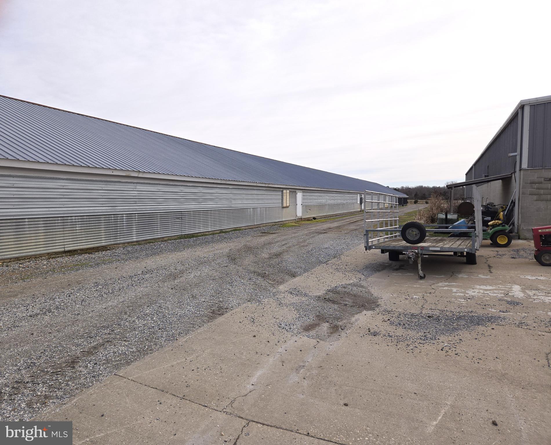 21498 Dover Bridge Road Preston, MD 21655 - Photo 23 of 33 a view of car parked on road with parking space