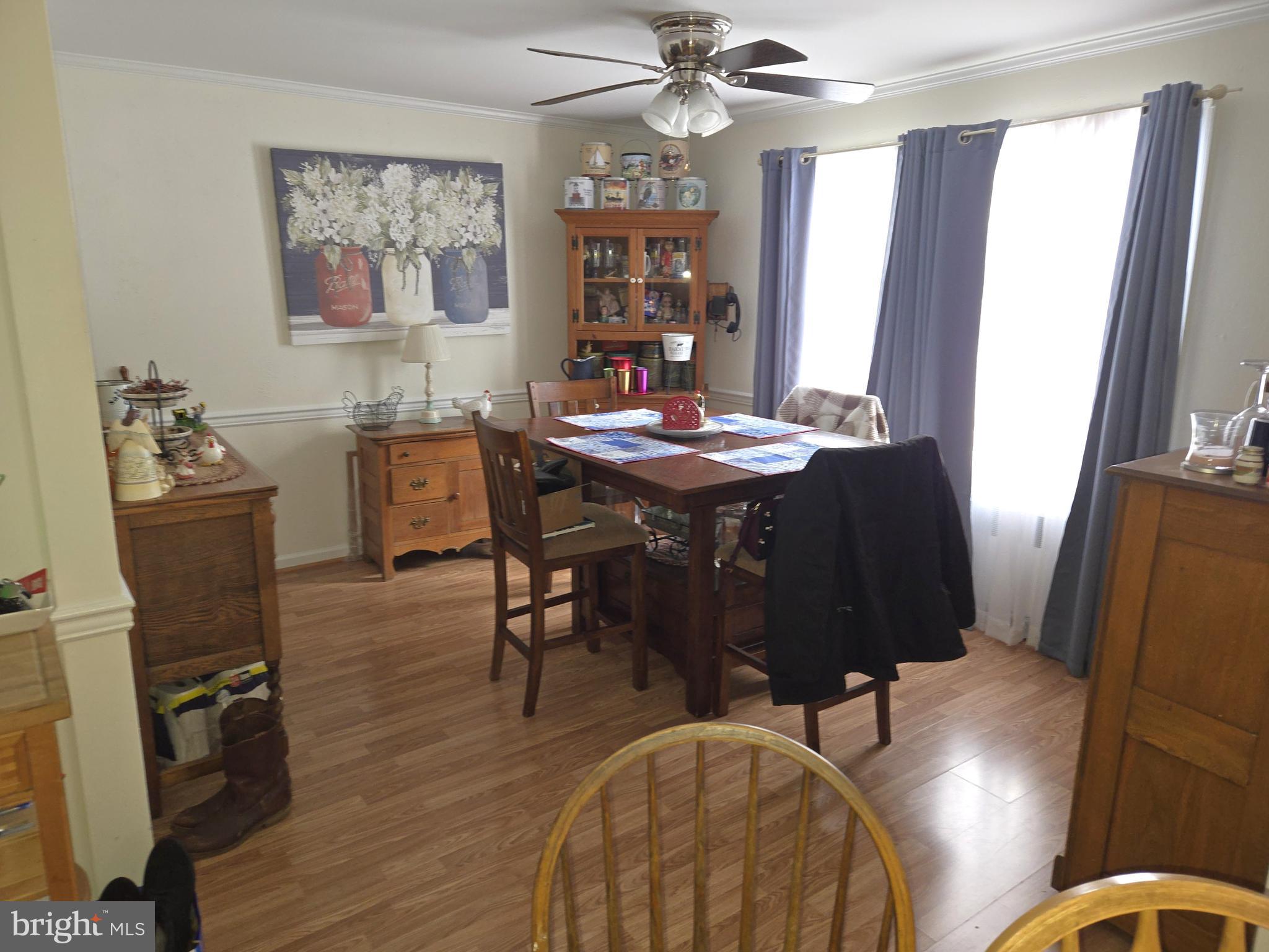 21498 Dover Bridge Road Preston, MD 21655 - Photo 6 of 33 a view of a dining room with furniture window and wooden floor