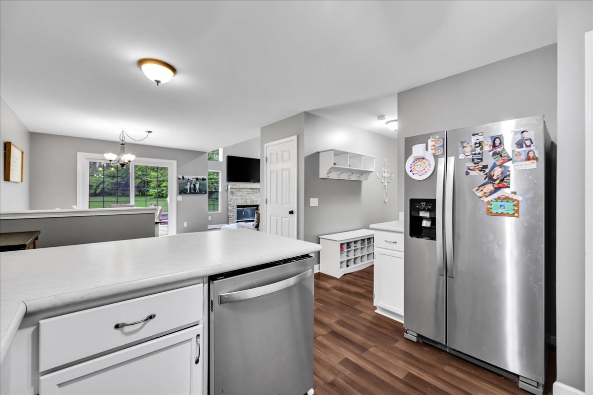 911 Fawn Ridge Court, Unit B Yorkville, IL 60560 - Photo 15 of 37 a kitchen with stainless steel appliances a refrigerator sink and microwave