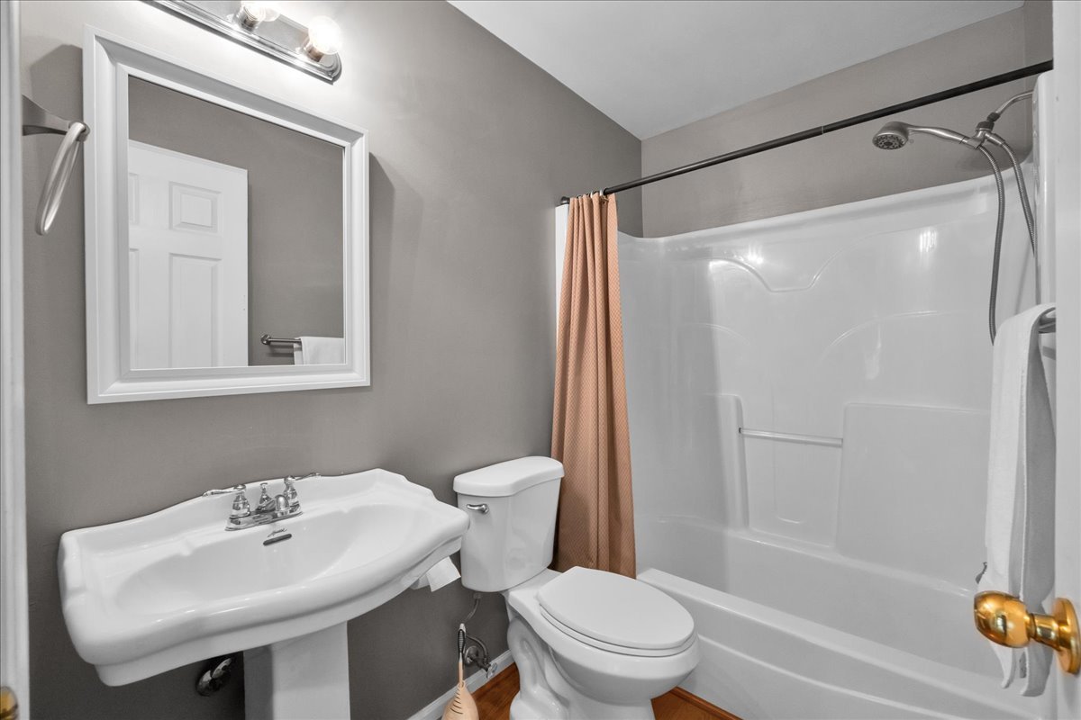 911 Fawn Ridge Court, Unit B Yorkville, IL 60560 - Photo 21 of 37 a bathroom with a sink toilet and shower