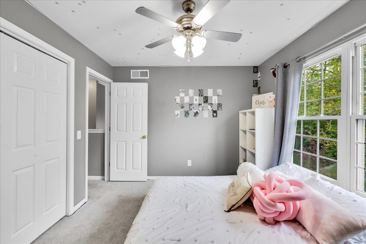 911 Fawn Ridge Court, Unit B Yorkville, IL 60560 - Photo 23 of 37 a bedroom with a bed and a window