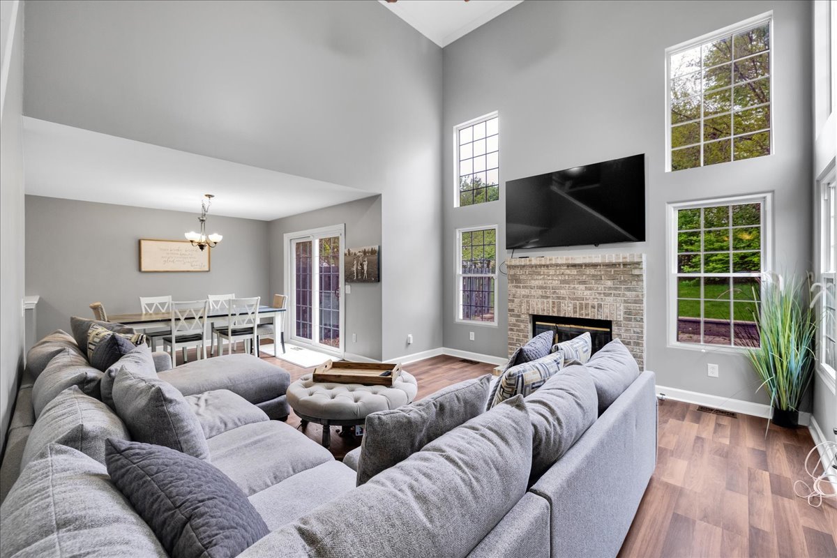 911 Fawn Ridge Court, Unit B Yorkville, IL 60560 - Photo 3 of 37 a living room with furniture fireplace and flat screen tv