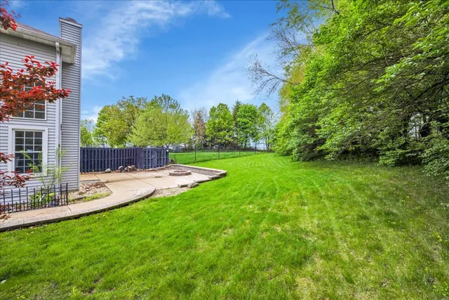 a view of a back yard with a patio