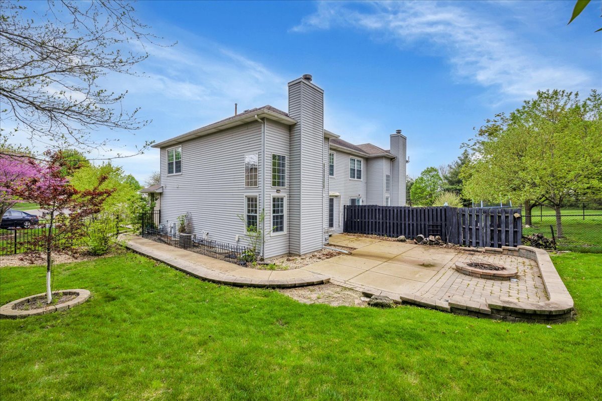 911 Fawn Ridge Court, Unit B Yorkville, IL 60560 - Photo 32 of 37 a view of a house with backyard