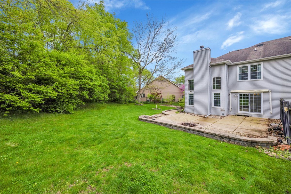 911 Fawn Ridge Court, Unit B Yorkville, IL 60560 - Photo 33 of 37 a view of a house with a yard and pathway