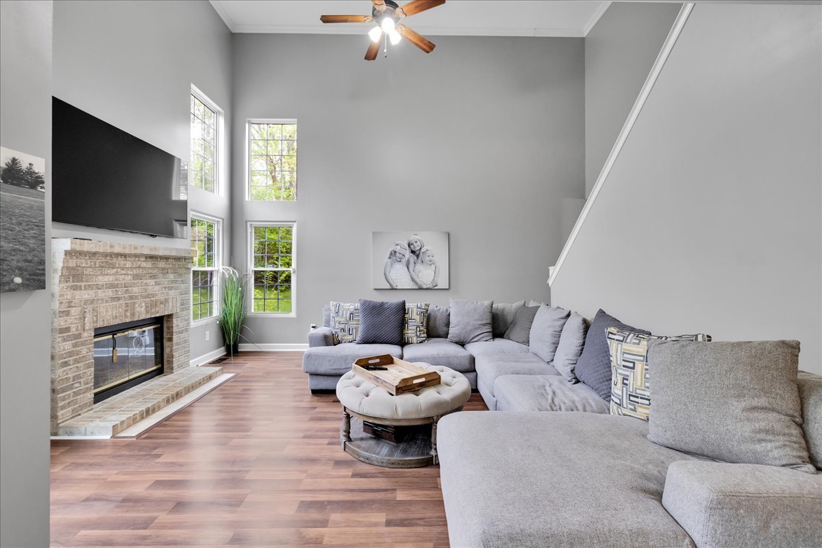 911 Fawn Ridge Court, Unit B Yorkville, IL 60560 - Photo 7 of 37 a living room with furniture fireplace and flat screen tv