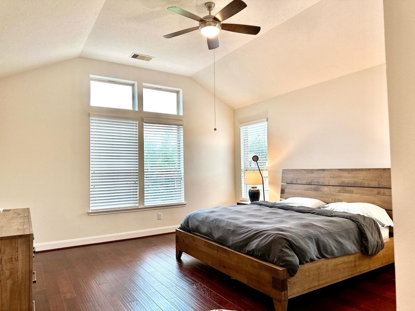 1110 Penny Ranch Lane Katy, TX 77494 - Photo 19 of 31 a bedroom with a bed and window