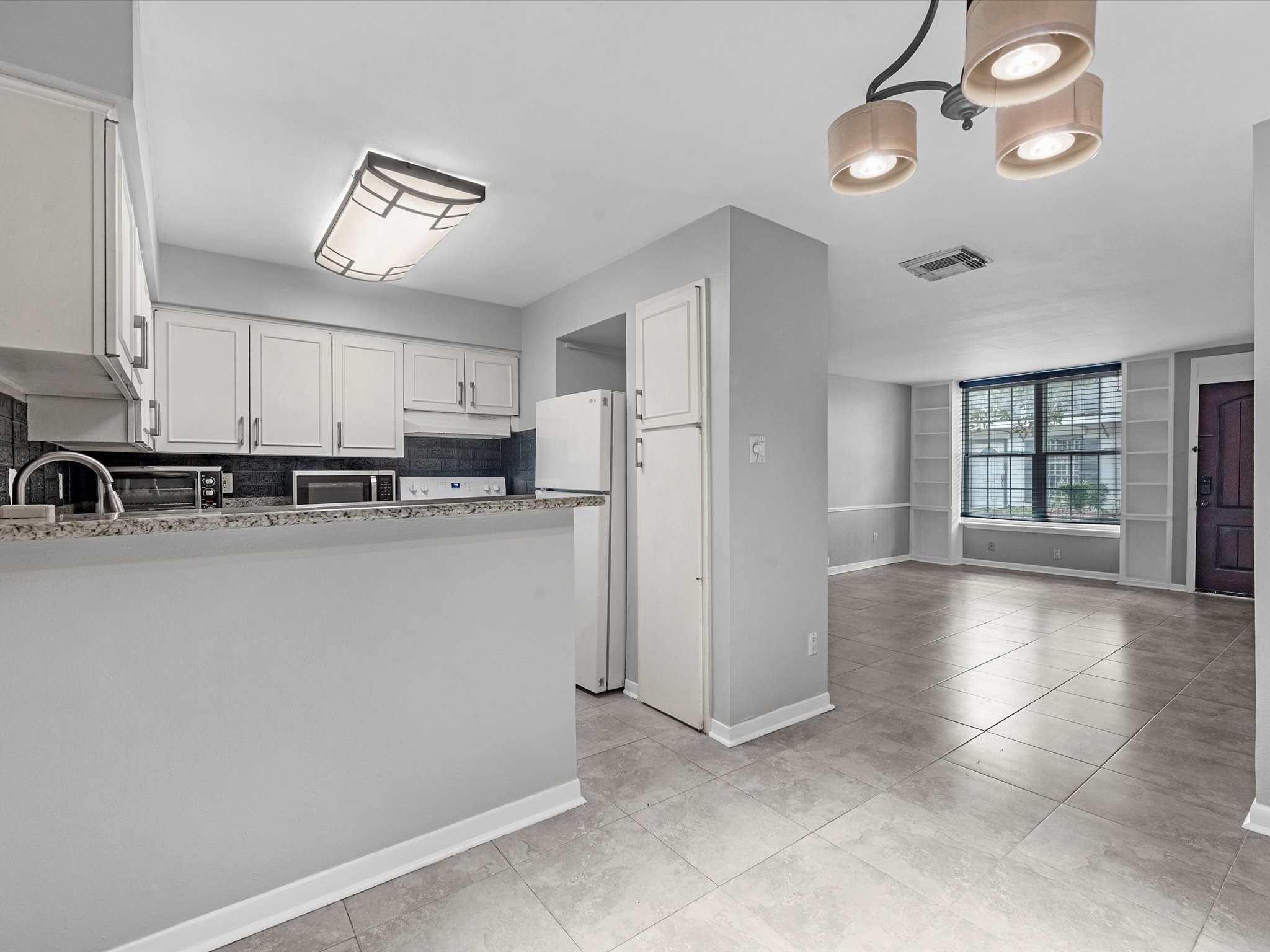 2647 Marilee Lane Houston, TX 77057 - Photo 15 of 26 a view of a kitchen with electric equipment