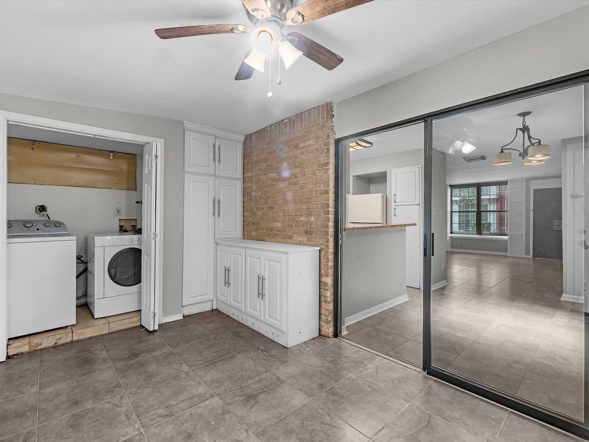 2647 Marilee Lane Houston, TX 77057 - Photo 16 of 26 a view of a hallway with washer and dryer