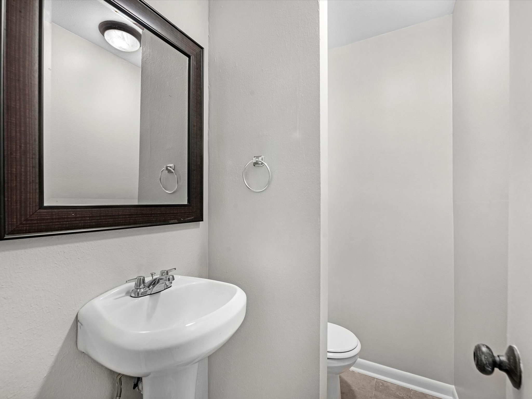 2647 Marilee Lane Houston, TX 77057 - Photo 17 of 26 a bathroom with a sink and a mirror