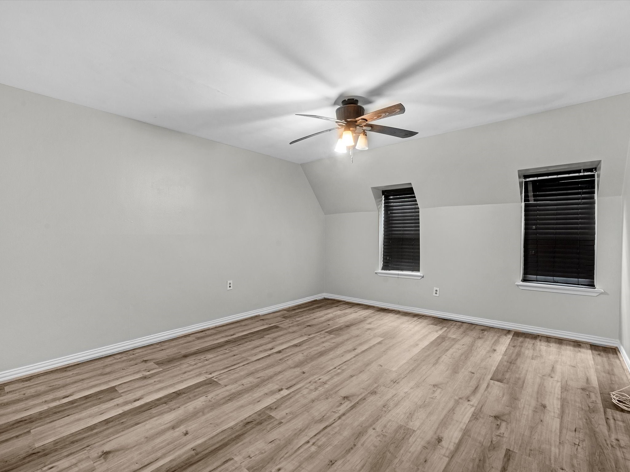 2647 Marilee Lane Houston, TX 77057 - Photo 18 of 26 a view of empty room with wooden floor and fan