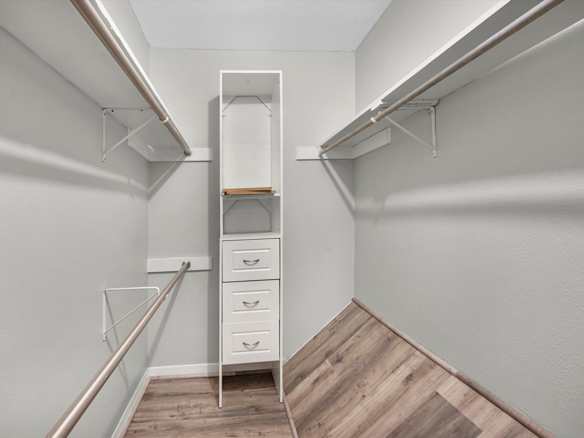 2647 Marilee Lane Houston, TX 77057 - Photo 20 of 26 a view of walk in closet with clothes and shoes
