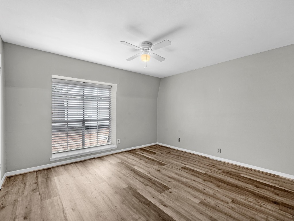 2647 Marilee Lane Houston, TX 77057 - Photo 22 of 26 wooden floor in an empty room with a window
