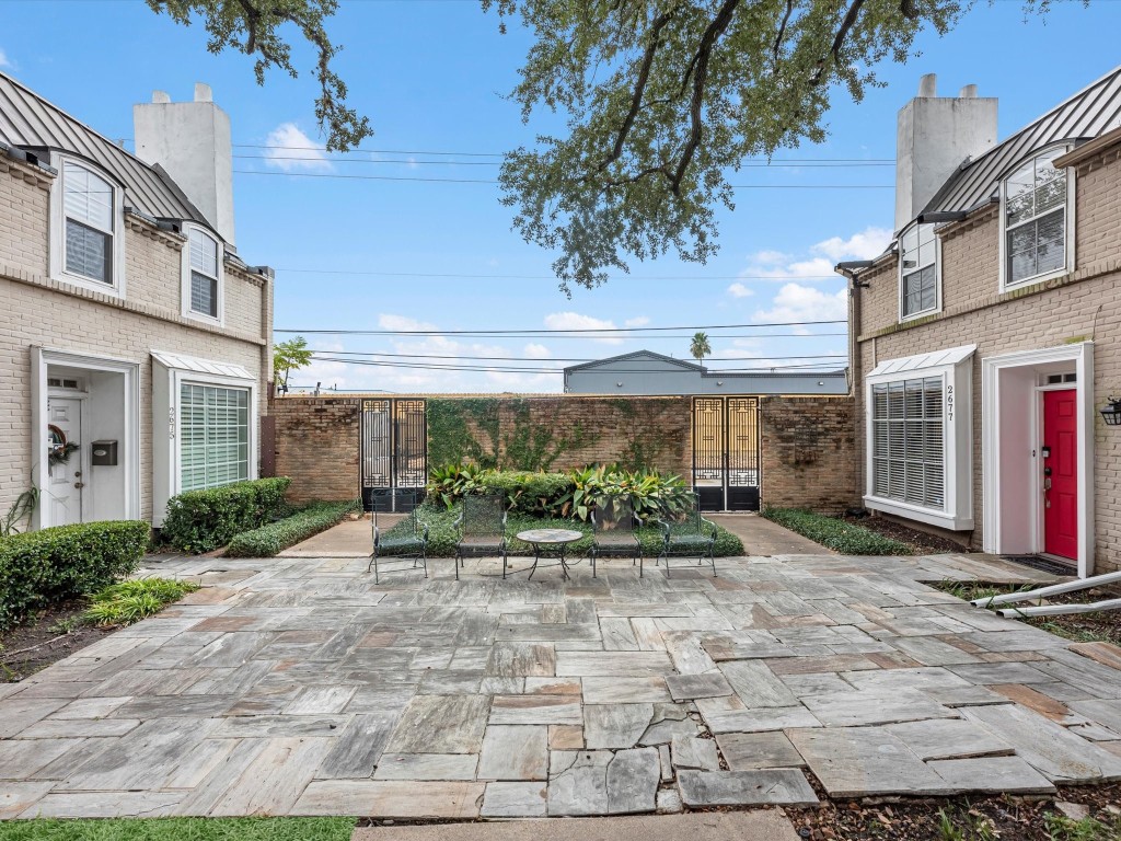 2647 Marilee Lane Houston, TX 77057 - Photo 25 of 26 a front view of a building with a yard