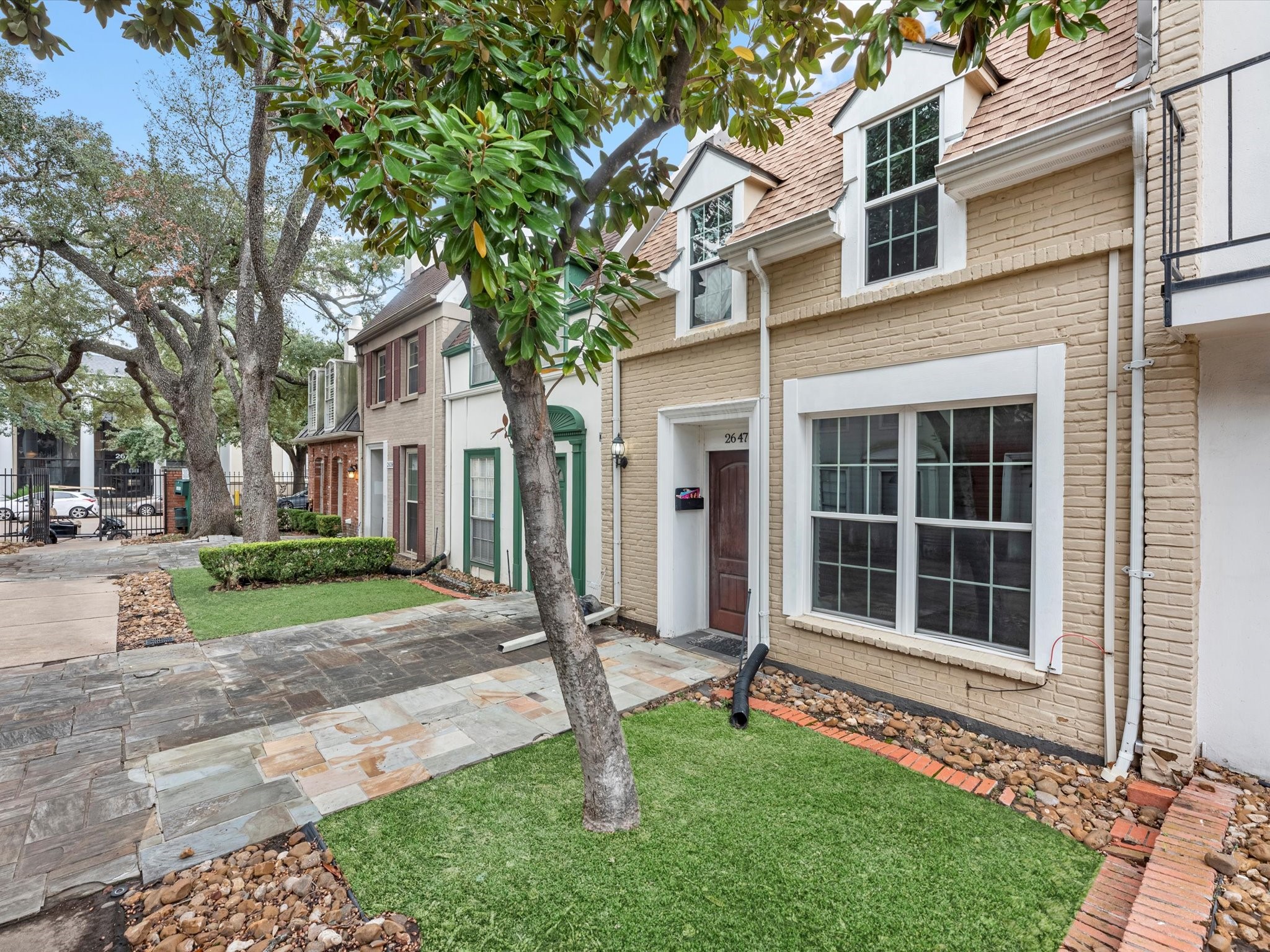 2647 Marilee Lane Houston, TX 77057 - Photo 3 of 26 a front view of a house with a yard