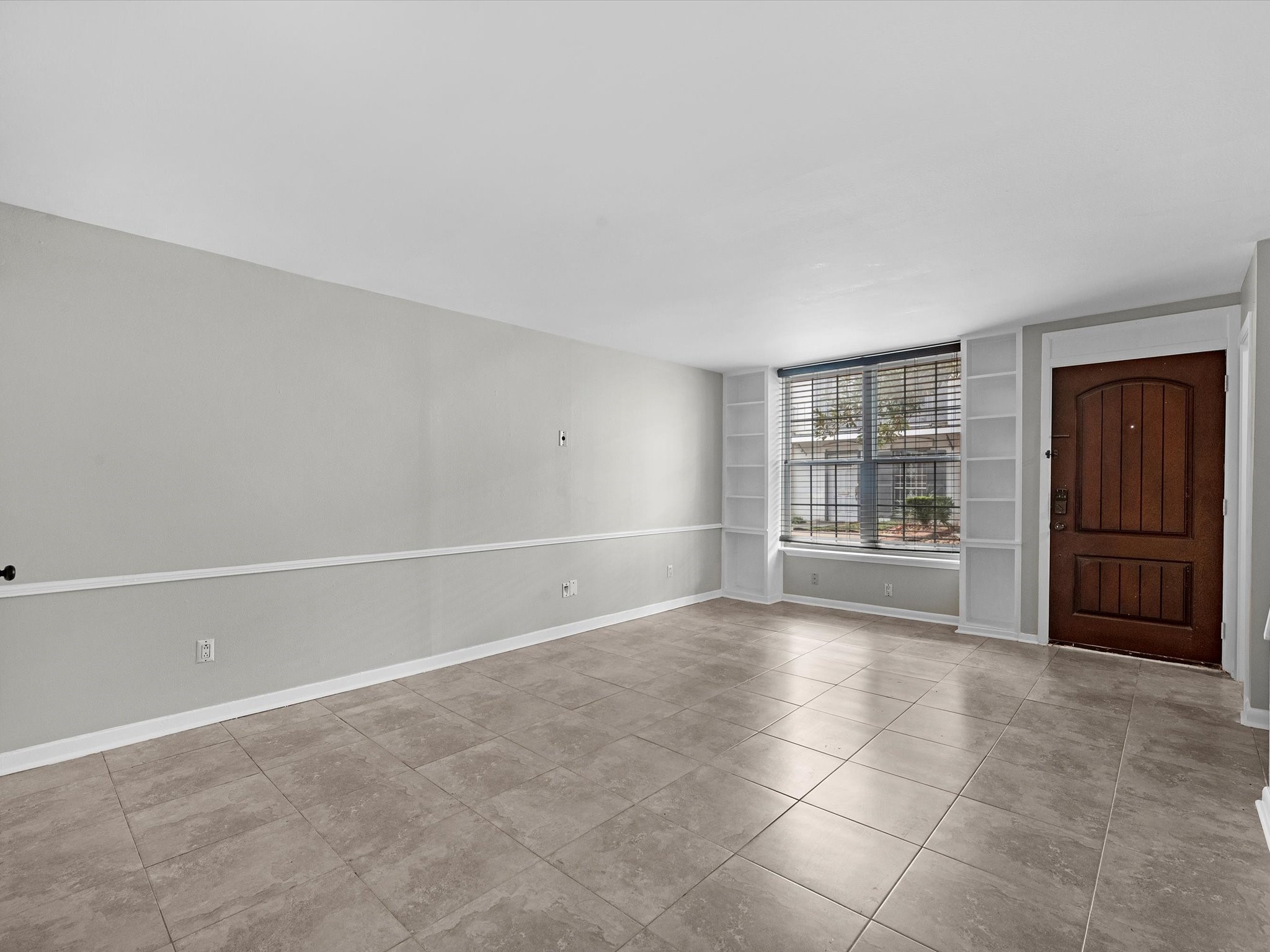 2647 Marilee Lane Houston, TX 77057 - Photo 9 of 26 a view of an empty room with a window