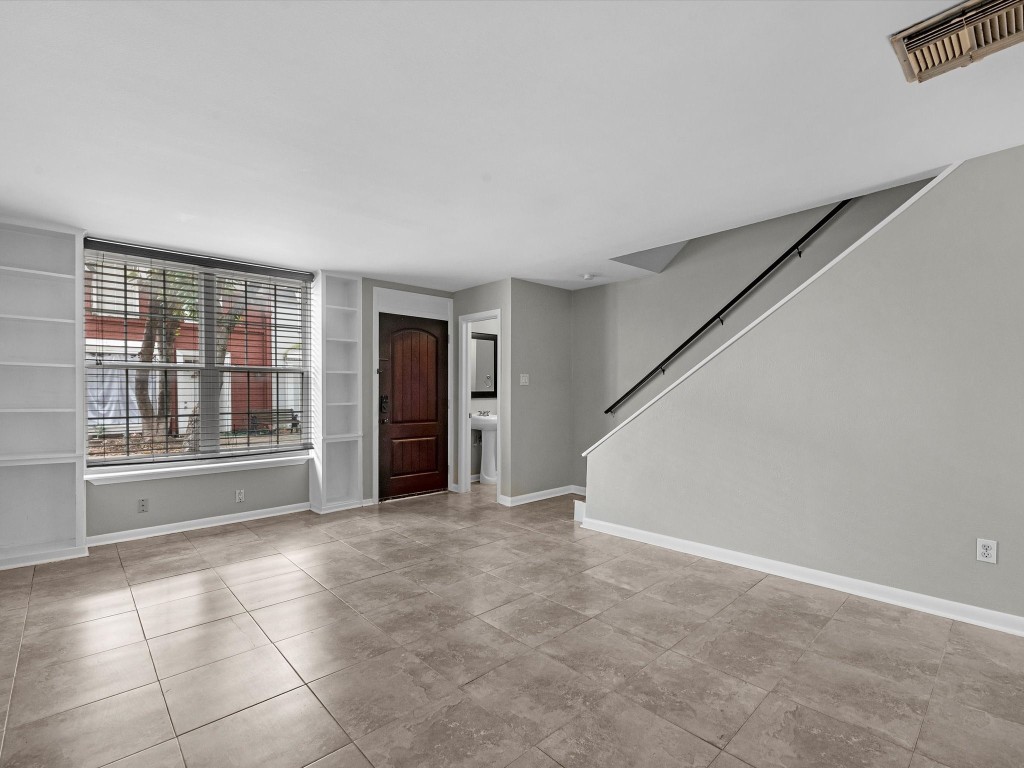 2647 Marilee Lane Houston, TX 77057 - Photo 10 of 26 a view of an empty room with a window