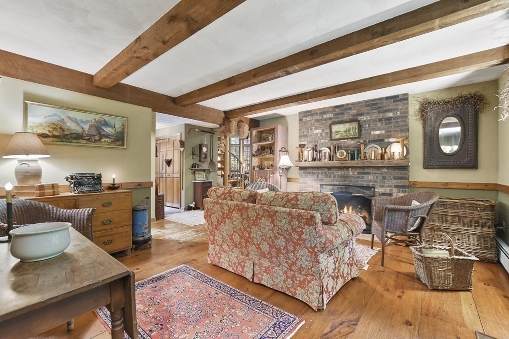 259 Hollis Road Lunenburg, MA 01462 - Photo 13 of 39 a living room with furniture and wooden floor