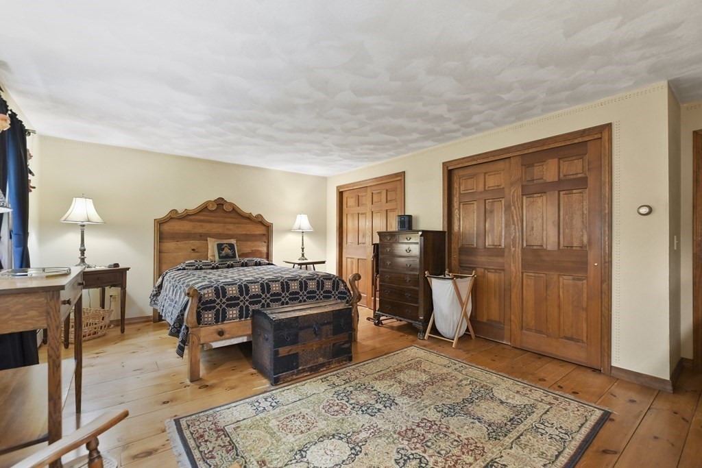 259 Hollis Road Lunenburg, MA 01462 - Photo 22 of 39 a living room with furniture and a wooden floor