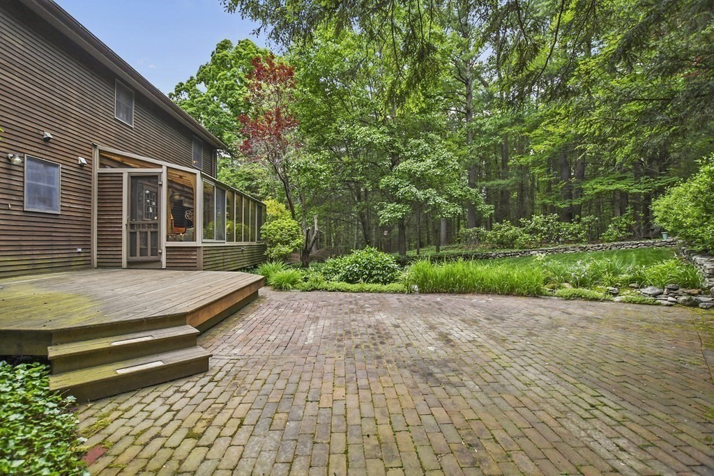 259 Hollis Road Lunenburg, MA 01462 - Photo 29 of 39 a view of a backyard with large trees and plants