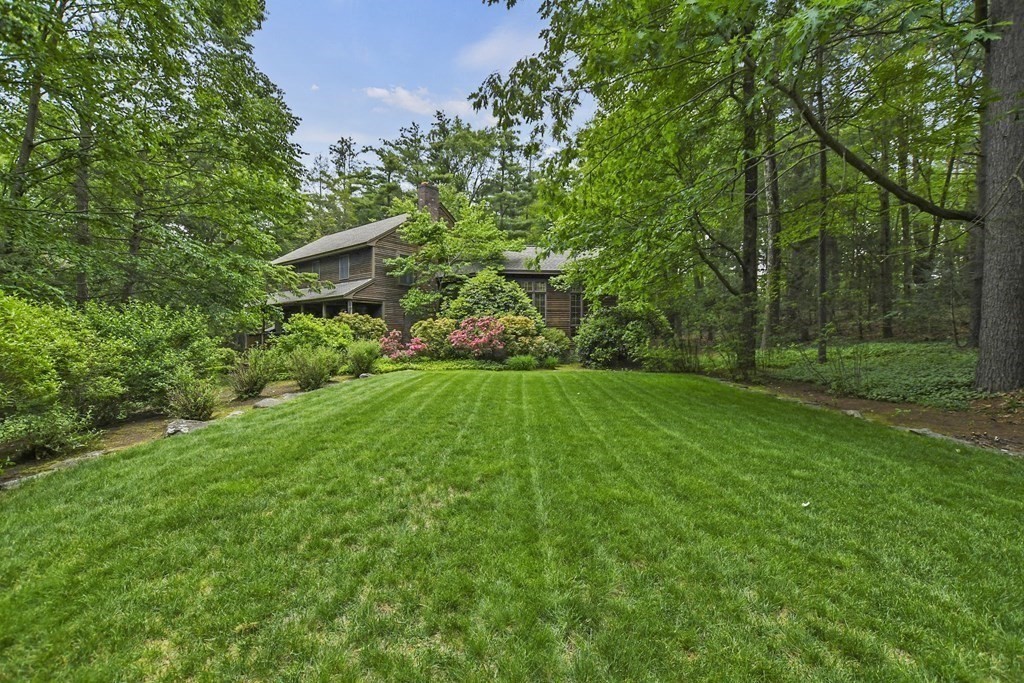 259 Hollis Road Lunenburg, MA 01462 - Photo 34 of 39 a view of a garden with large trees