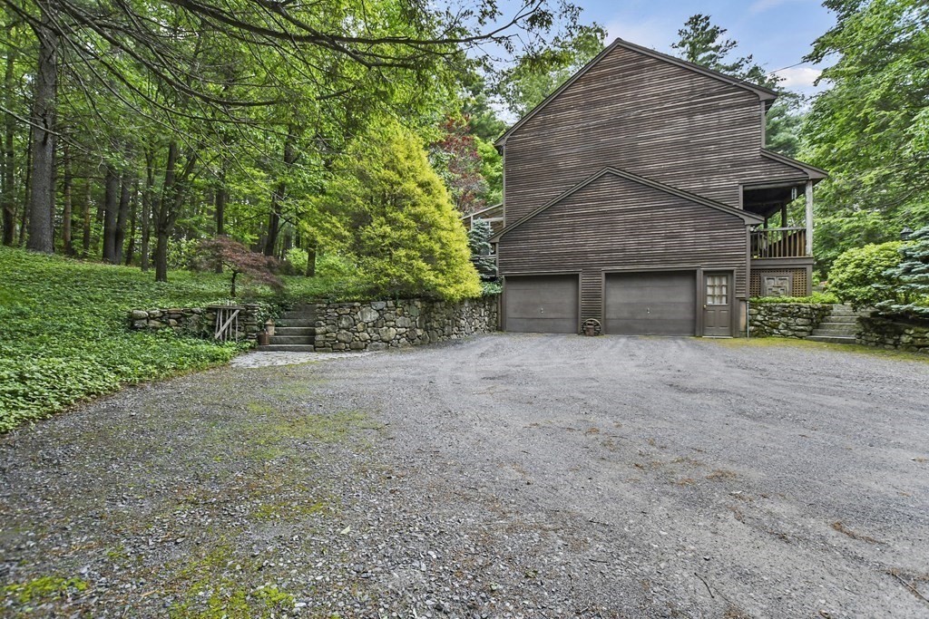 259 Hollis Road Lunenburg, MA 01462 - Photo 39 of 39 a front view of a house with a yard and garage